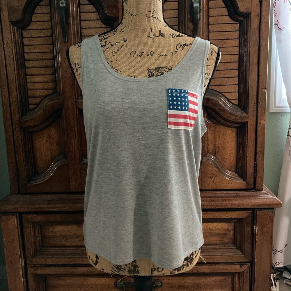 Woman’s gray tank with American flag on pocket, size medium.